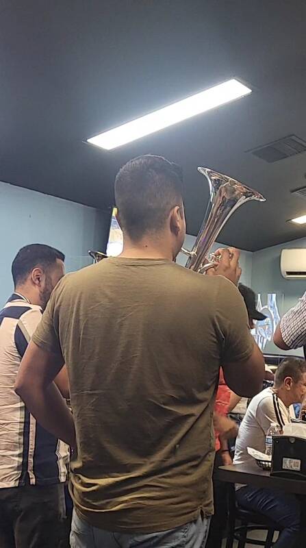 A brass band playing in the MacBe dining room.